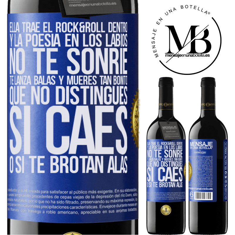 39,95 € Envío gratis | Vino Tinto Edición RED MBE Reserva Ella trae el Rock&Roll dentro y la poesía en los labios. No te sonríe, te lanza balas, y mueres tan bonito, que no Etiqueta Azul. Etiqueta personalizable Reserva 12 Meses Cosecha 2014 Tempranillo