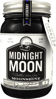 Envío gratis | Licores Midnight Moon Moonshine Blueberry Estados Unidos Botellín Tercio 35 cl