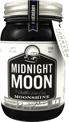 Kostenloser Versand | Liköre Midnight Moon Moonshine Blueberry Vereinigte Staaten Drittelliterflasche 35 cl